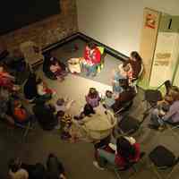 Color photos, 20, of Penny Metsch reading to a Story Time children