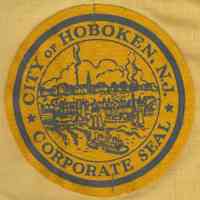 Sash, yellow cloth, with applied felt emblem with the Corporate Seal of the City of Hoboken, Hoboken, [1955.]