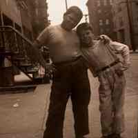 Black-and-white negative of two boys posed in front of an apartment building, Hoboken, no date, ca. 1930-40.