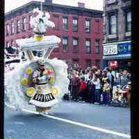 Color slide of a man walking in a parade.