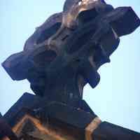          20: stone cross on roof above main entrance, east facade
   
