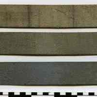          back of three leather samples
   