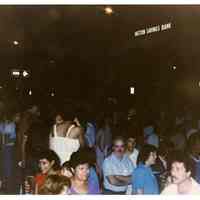 Color photo of supporters of mayoral candidate Tom Vezzetti in front of City Hall on election night, Hoboken, [June 11, 1985].