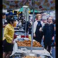 Color slide of a food stall at a street fair.