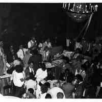 B+W photo of Tom Vezzetti speaking to campaign supporters in Union Club ballroom on election night, Hoboken, [June 11, 1985].