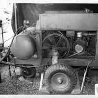 B+W photos, 2, of 1000 hour endurance test of a U.S Army portable air compressor at United States Testing Co., Hoboken. N.d., ca. 1970s or 1980s.