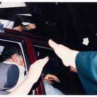 Color photo of mayoral candidate Tom Vezzetti in front seat of car on election night, Hoboken, [June 11, 1985].