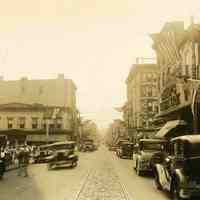 Sepia-tone photo of a view looking down First Street from Washington Street, Hoboken, 1933.