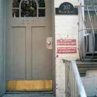 Color photo of three signs at the front entrance of 307 Willow Avenue, Hoboken, Sept., 1-5, 2001.