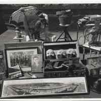 B+W photo of antique items laid-out for sale at a flea market in Neuman Leather building parking lot, Hoboken, no date, ca. 1994-95.