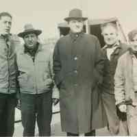 B+W group photo of "On the Waterfront" filming in Hoboken: Karl Malden is at the center, Hoboken, no date, ca. late 1953-early 1954.