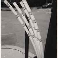 B+W photo of utility cables with Burczy poster stickers, NW corner of Bloomfield and Newark Sts., ca early May 2006.