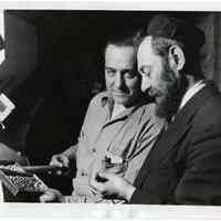 B+W photo of Rabbi Hersch Kohn inspecting coffee at Maxwell House Coffee plant, Hoboken, March 23, 1949.