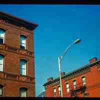 Color slide of close-up view of cornices, friezes, window heads and fire escapes on unidentified buildings at 12th and Washington