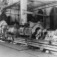 B+W photo of tube for propeller drive shaft on large lathe, machine shop, August, 1940.