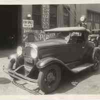 Sepia-tone photos, 3, of automobile parked outside a garage, Hoboken, Apr.15, 1933.