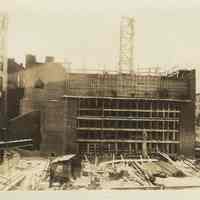 Sepia-tone photo of steel frame erection & construction of the stage house for the Fabian Theatre, Hoboken, no date, ca. Feb.-March, 1928.