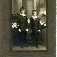 Sepia-tone photo of 2 young boys posed in studio, Hoboken, n.d., ca. 1900-1920