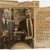 Digital image of newsclipping with photo of Mayor Steve Cappiello & Carl Jordan, U.S. Small Business Administration, Hoboken, March 7, [1985].