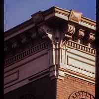          Color slide of detail view of cornice, brackets, dentils, frieze and brick semicircular arches at 209 14th Street on the SE corner with Park picture number 1
   