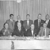 B+W photo of William T. Sperber, of Tietjen & Lang Dry Dock Co., & 10 fellow attendees at a dinner, no place, n.d., ca. 1945-1950.