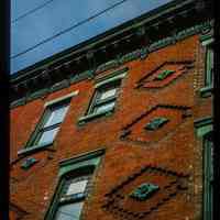          Color slide of detail view of façade, decorative tiles, stained glass windows and cornice at 1201 Garden on the NW corner of 12th picture number 1
   