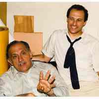 Color photo of mayoral candidate Tom Vezzetti with supporter possibly inside his campaign headquarters on election night, Hoboken, [June 11, 1985].