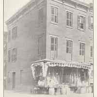 Printed B+W photograph of John H. Thiesmeier, grocer, 112 Seventh Street, Hoboken, no date, ca. 1907-1908.