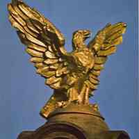 Reference image of printed photo image of City Hall gold eagle from the cover of 2002.026.0002, Hoboken, ca. 1975.