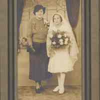 Sepia-tone studio photo of Mildred Marion "Molly" Pescatore with a girl at the time of her confirmation, Passaic, no date, ca. 1930.
