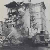 Reference image of printed photo image of building demolition from pg [32] of archives catalog 2002.026.0002, Hoboken, ca. 1975.