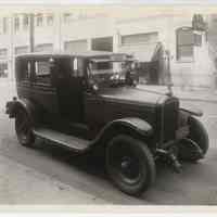 Sepia-tone photos, 2, of Hudson Cab Co. taxicab No. 28 parked at 217 Clinton St., across from Model Garage, Hoboken, n.d., probably 1928 (license plate date.)