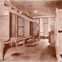 Photograph, printed: interior view of animal cages/stalls in building used for imported wild animals, 307 Newark St., Hoboken, n.d., ca. early 1920s.