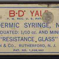 Glass hypodermic syringe, 2 cc, in box from Stemple Pharmacy, 266 Seventh St., Hoboken, no date, ca. 1950-1970.