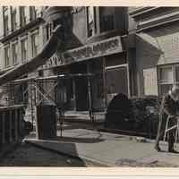 B+W photo of 1224 Washington Street exterior with demolition chute & debris container, Hoboken, n.d, ca. 1983-1988.