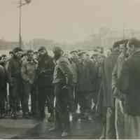 B+W candid group photo of "On the Waterfront" filming in Hoboken: Marlon Brando is in profile at center, Hoboken, no date, ca. late 1953-early 1954.