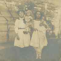 Sepia-tone photo of Madeline Miller, ca. 7-8 years old, with an unidentified girl in the backyard of 716 Bloomfield St., Hoboken, no date, ca. 1890-9