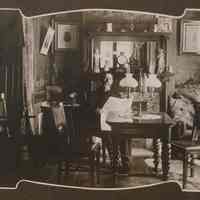 Sepia-tone photo of Otto F. Reese (1869-1922) seated in a parlor, n.p., n.d, ca. 1915-1922.