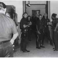 B+W printof Hoboken Police officers at Police Headquarters during state of emergency, Hoboken, ca. 1970-1971.