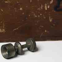          threaded post for attaching to tripod and plumb bob
   