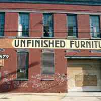 Color photo of a painted wall sign, Unfinished Furniture, at 715 Grand St., Hoboken, Jan. 3 & 4, 2002.