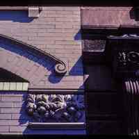          Color slide of detail view of pediment, bracket, gauged arch and decorative tile on adjoining buildings on Bloomfield between 7th and 8th picture number 1
   