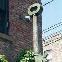 Color photo of hanging metal key sign on 63 Willow Terrace, Hoboken, Sept., 1-5, 2001.