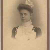 Cabinet photo of a young woman posed in photographer