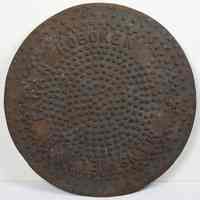 Coal chute cover or drain cover lettered Hoboken and Mansfield & Fagan. N.d., circa 1890-1920.