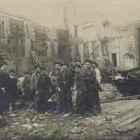 Sepia-tone photo of exterior view of the aftermath of fire at John Schmalz