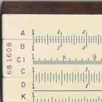         detail front of slide, left end, model number & scales
   