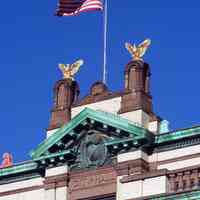          24: view: copper pediment, cartouches, gilded eagles, flagpole, east facade
   