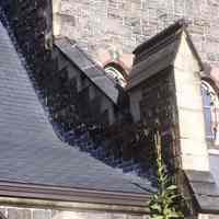          34: partial view of buttress, shingled roof, east facade
   