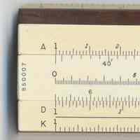          slide inverted, left end: scales & serial number; slide scales at other end
   